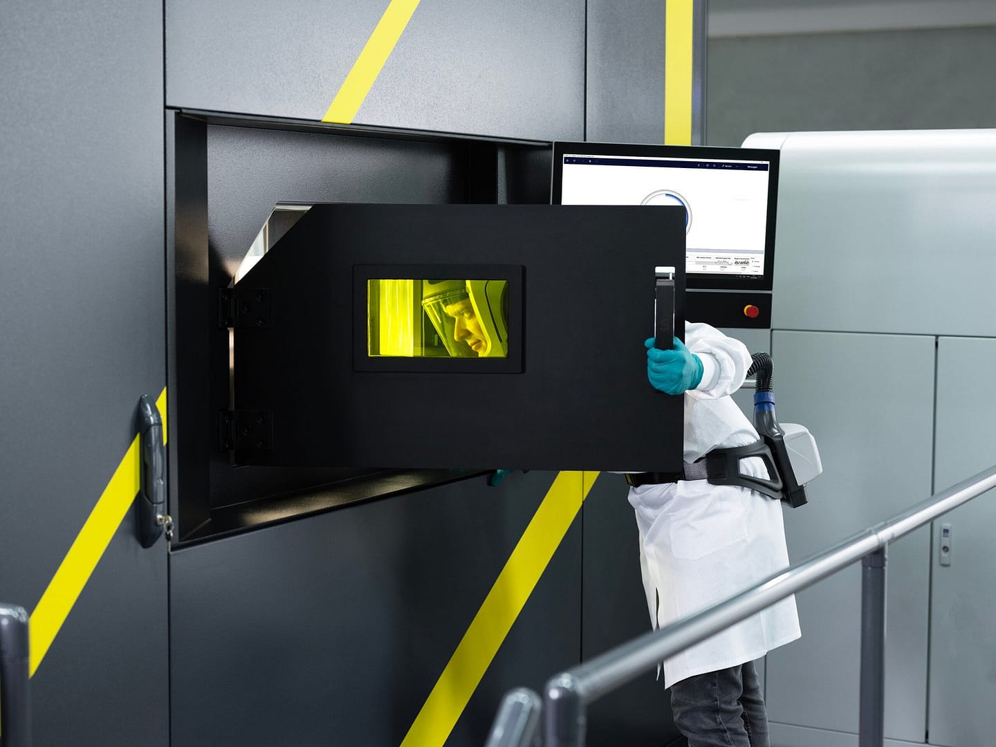 Championing a Made-in-America Future for Additive Manufacturing3DPrint.com | Additive Manufacturing Business 10 2024 Nikon SLM NG600E Operator ProtectiveGear CloseUp 572 copy xZXFUt scaled